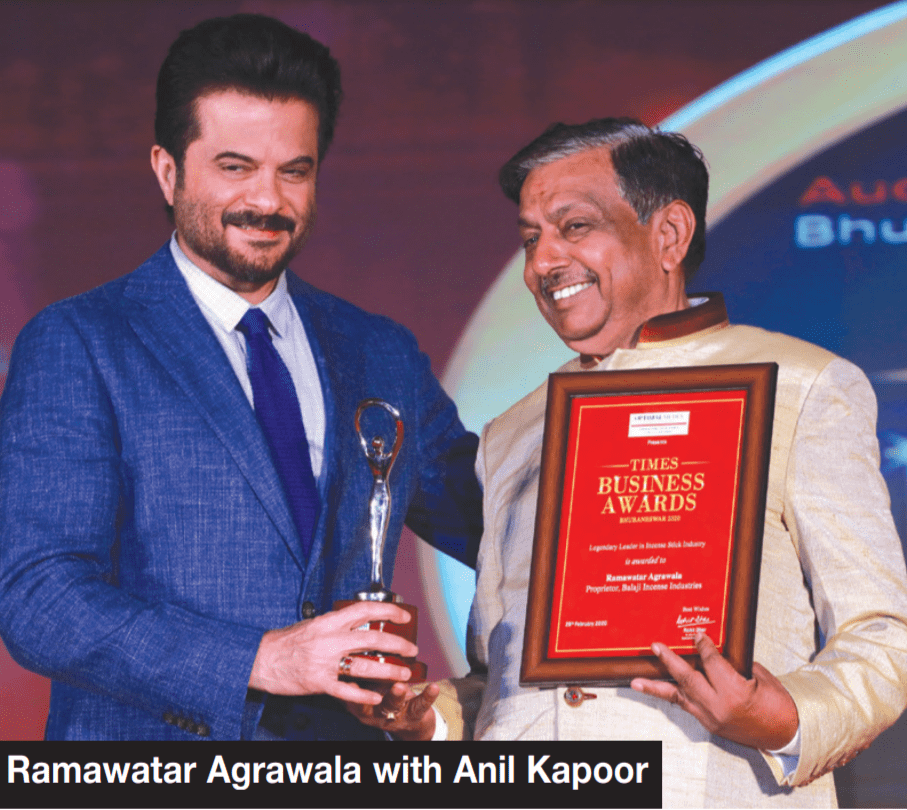 Madhukunj receiving the Times Business Award with Anil Kapoor